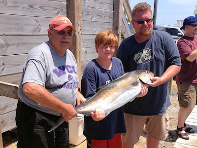 Young angler shows off big amberjack.