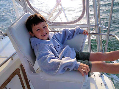 Young charter angler enjoys view from the Instigator bridge.
